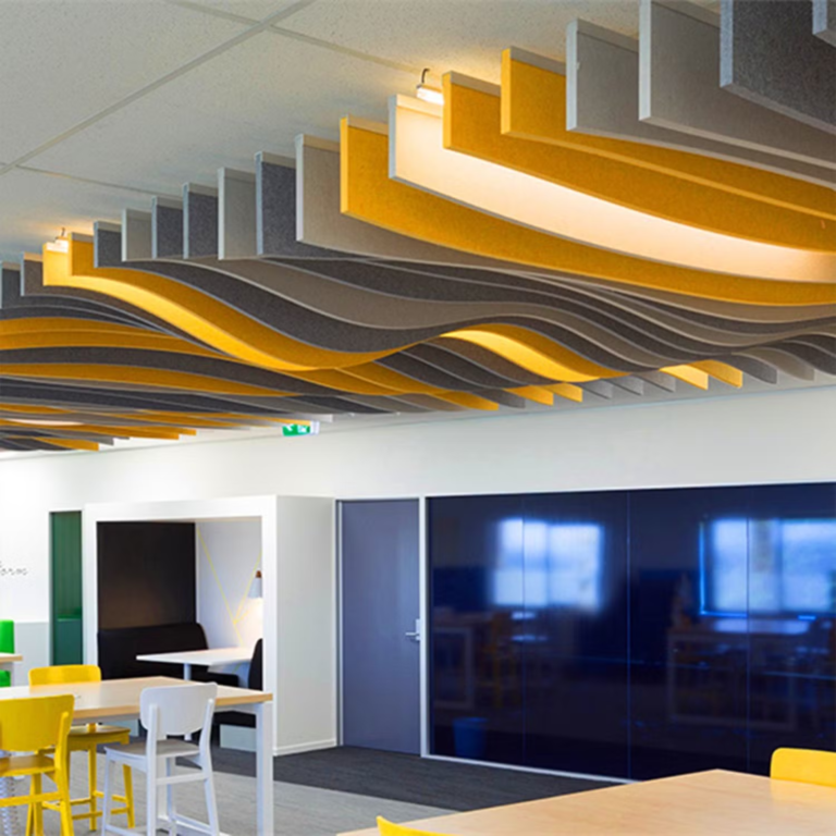 Curved wave acoustic ceiling baffles applied in commercial interior space