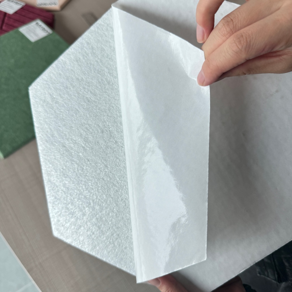 Self-adhesive PET felt acoustic panel, peeling off release liner of backing tape